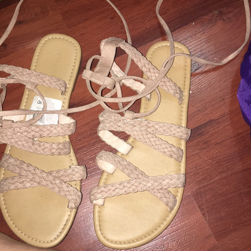 Pink gladiator sandals .